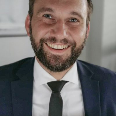 Michael Bergmann lächelt in die Kamera